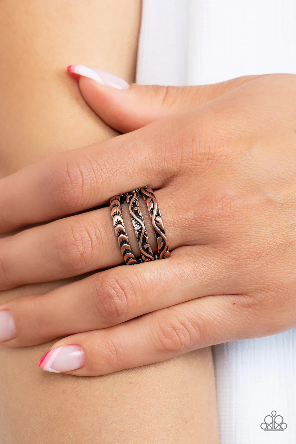 Paparazzi Accessories Canyon Canopy - Copper Three copper bands, embellished with floral motifs, stack into an airy display atop the finger. Features a stretchy band for a flexible fit. Sold as one individual ring. Jewelry