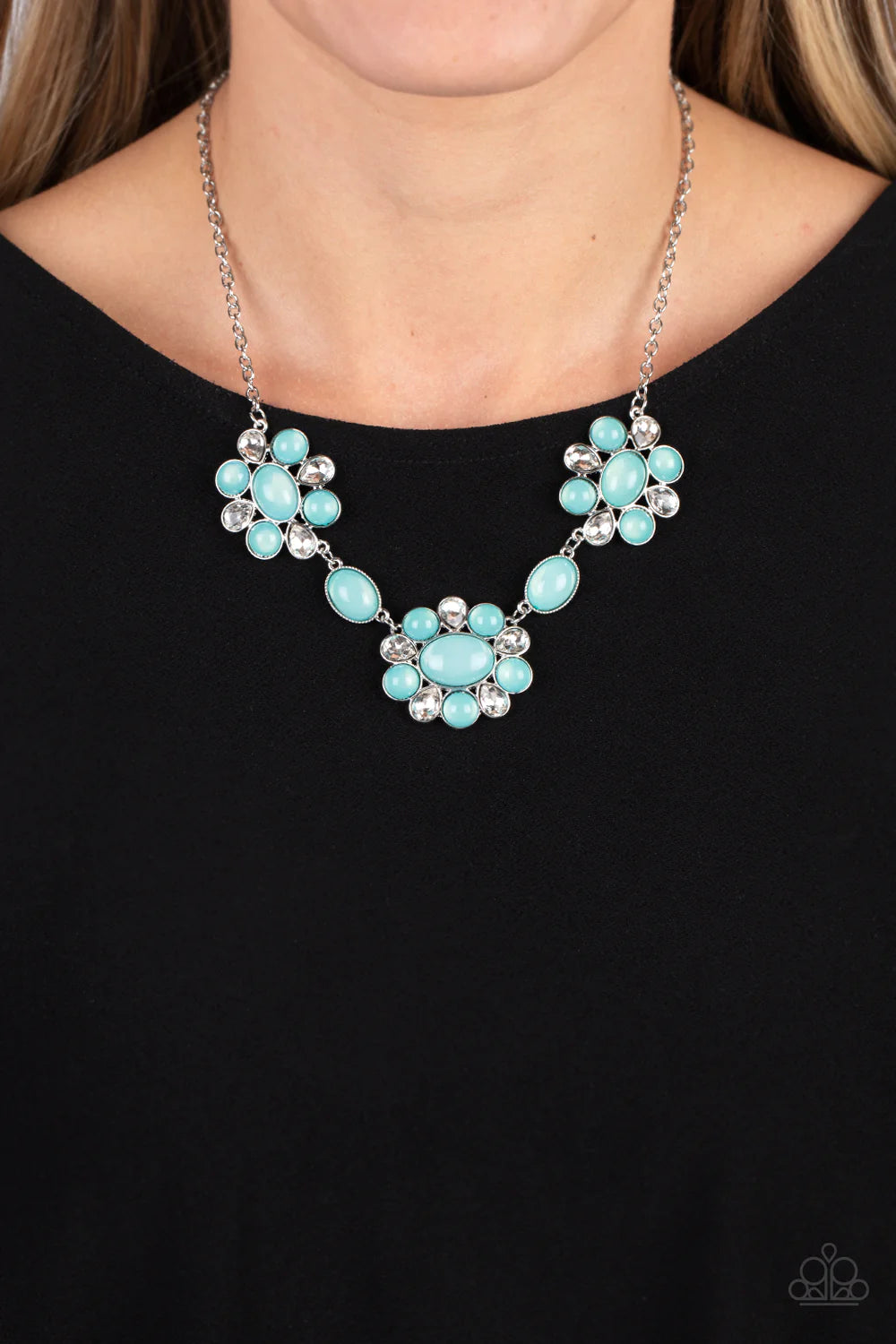 Paparazzi Accessories Your Chariot Awaits - Blue Brilliant, white, teardrop-shaped rhinestones, set in silver fittings, are set between glassy opalescent beads in the tranquil shade of Waterspout, wrapping around an oval bead in the same blue tint to crea