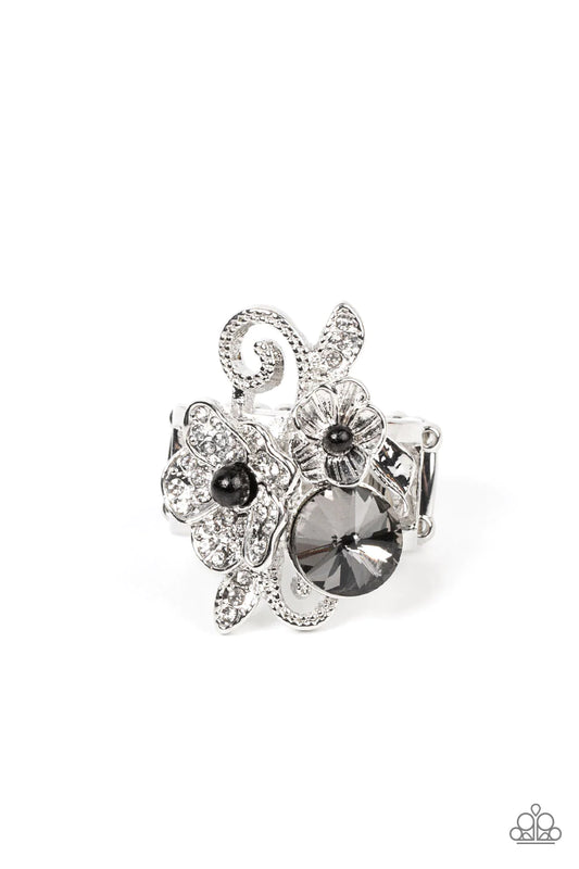 Paparazzi Accessories Bucketful of Bouquets - Black Dotted with dainty black bead centers, a textured silver blossom and white rhinestone dotted silver flower bloom around an oversized smoky gem. Studded silver filigree and white rhinestone dusted leafy f