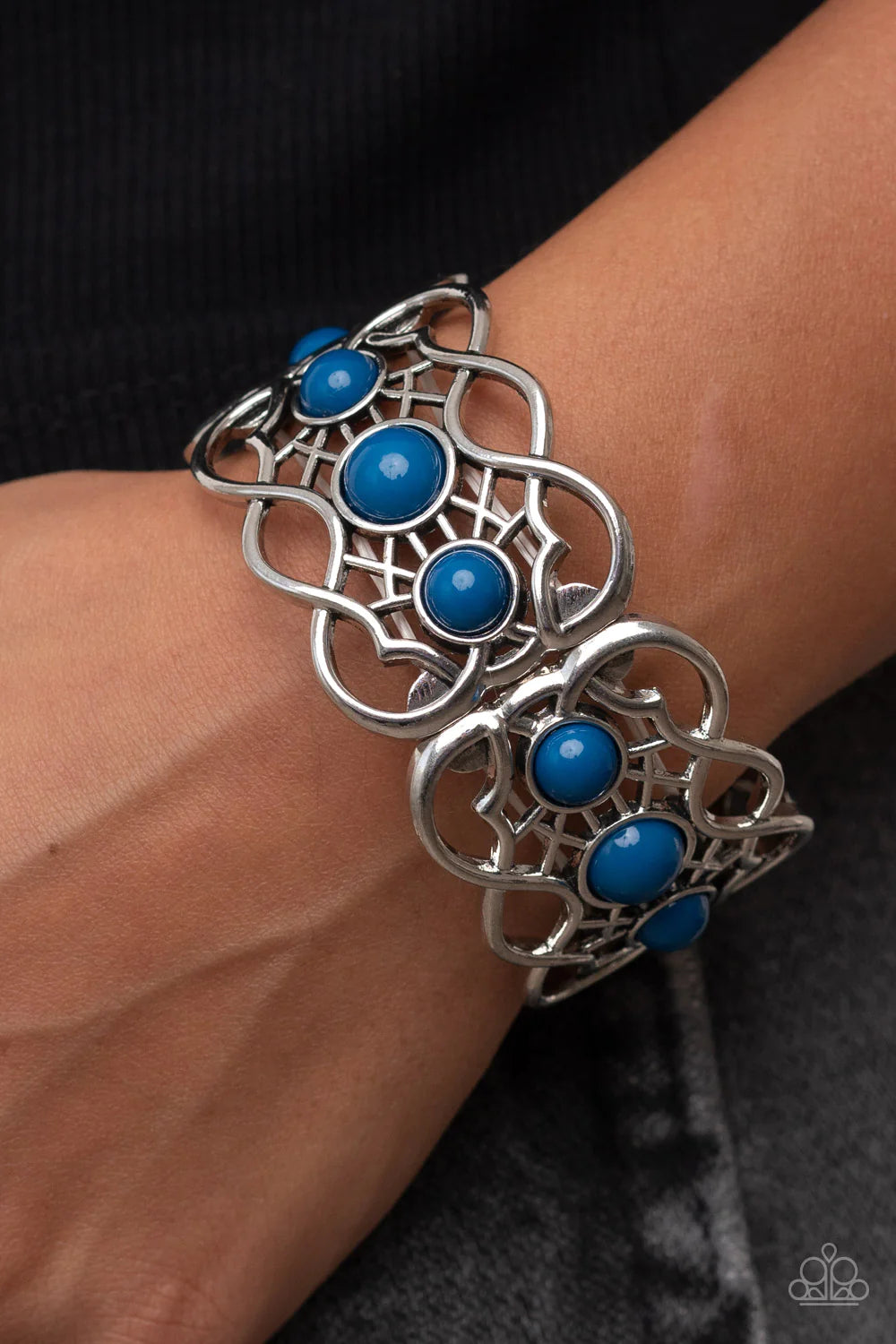 Paparazzi Accessories Very Versailles - Blue A trio of bubbly Mykonos Blue beads adorn the centers of vine-like silver frames that are threaded along a stretchy band around the wrist, creating a whimsical centerpiece. Sold as one individual bracelet. Jewe