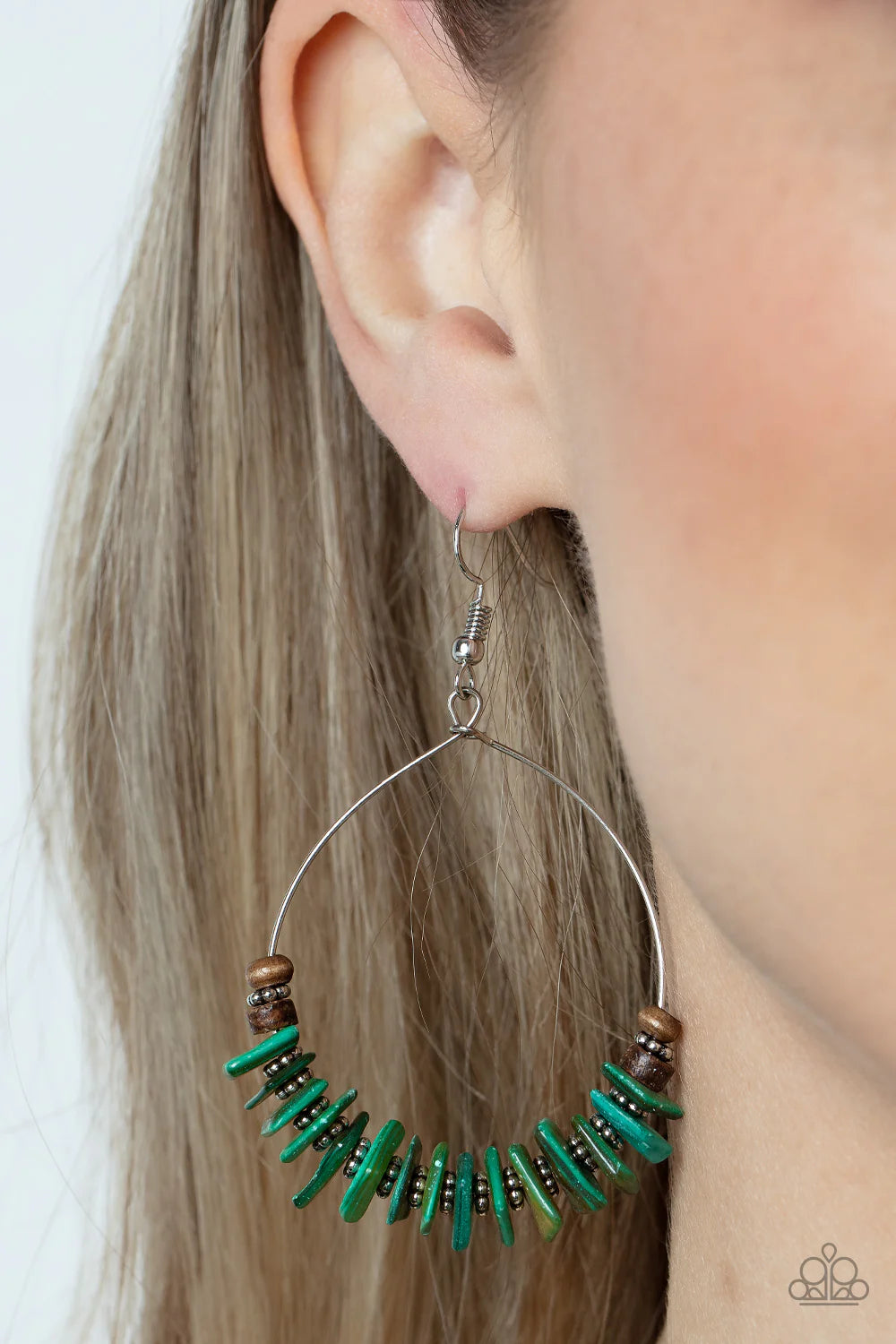 Paparazzi Accessories Hawaiian Kiss - Green Infused with earthy wooden accents, studded silver rings and pieces of green shell-like pebbles alternate along a dainty wire hoop for a tropical inspiration. Earring attaches to a standard fishhook fitting. Sol