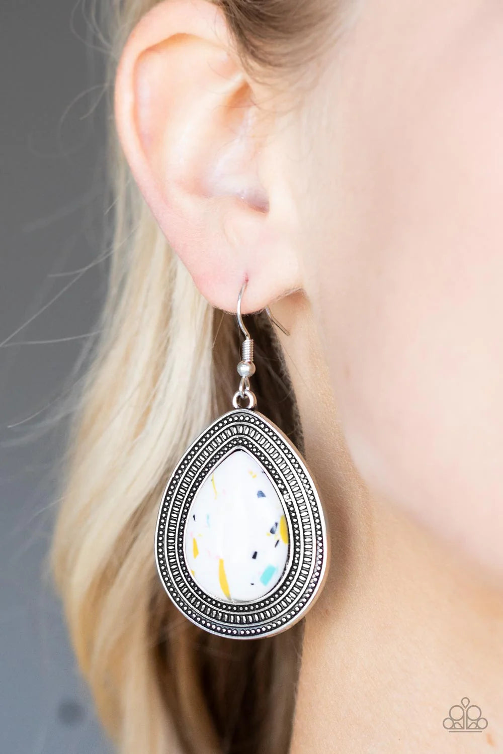 Paparazzi Accessories Terrazzo Tundra - Multi Featuring a colorful terrazzo pattern, a white teardrop stone is pressed into the center of a silver frame studded and embossed in borders of tribal inspired textures. Earring attaches to a standard fishhook f