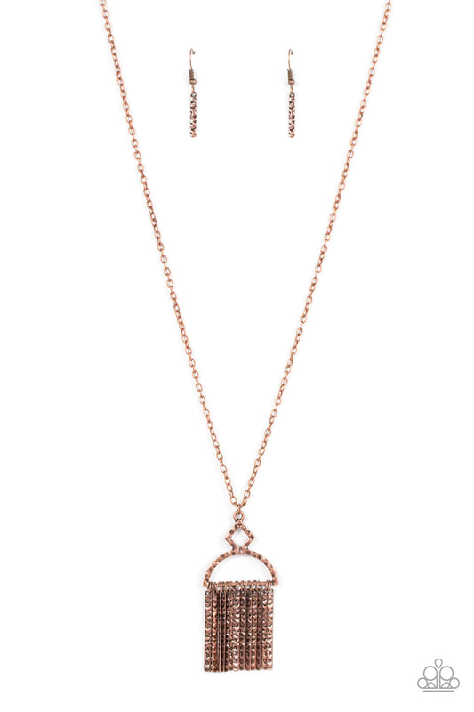 Paparazzi Accessories Getting of the Hang of Things - Copper A rustic fringe of hammered cooper pendulums swings from the bottom of a hammered geometric pendant. The half moon-like pendant swings from the bottom of an extended copper chain, creating a noi