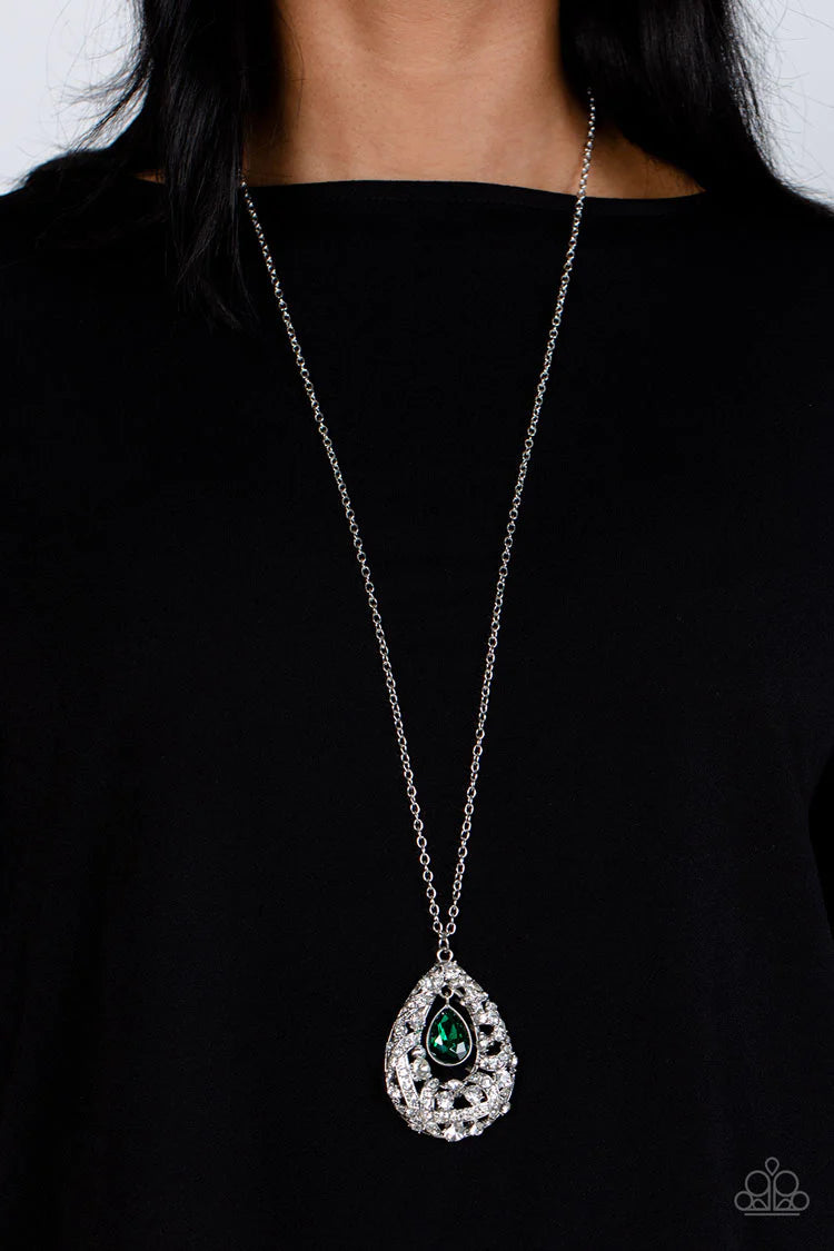 Paparazzi Accessories Glitz and GLOW - Green A small teardrop, crystal-like emerald green gem is pressed into a sleek, silver frame as it's suspended from a larger gem and rhinestone-dusted airy teardrop frame. The various sizes of crystal-like gems and w