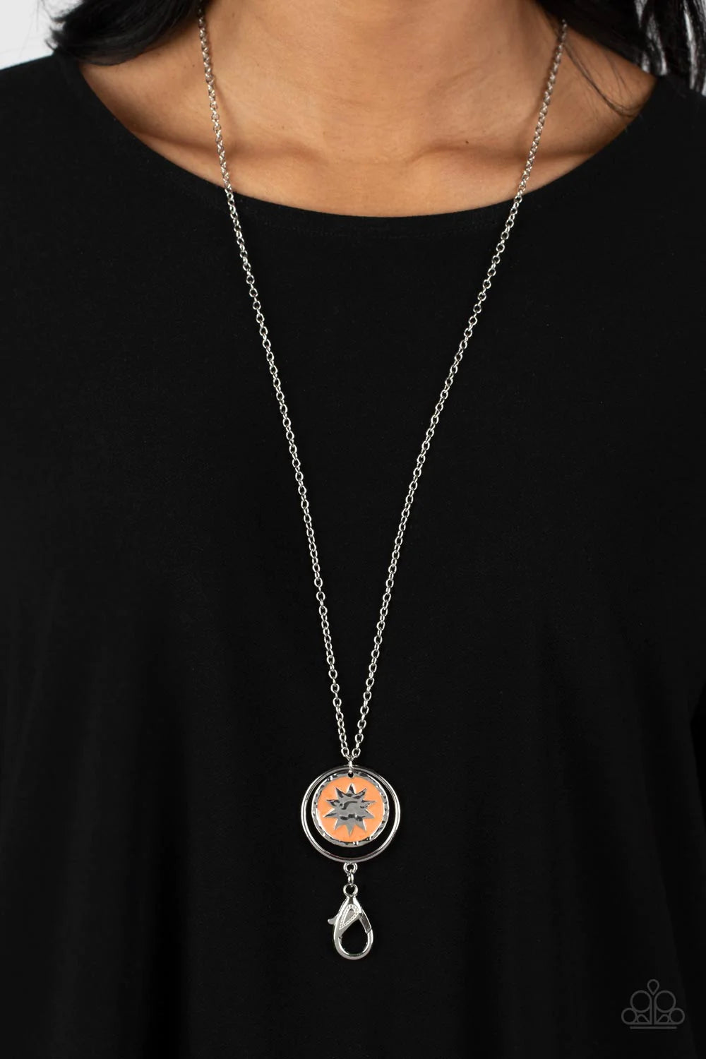 Paparazzi Accessories Cretian Crest - Orange Dangling from an airy silver hoop, a silver hammered ring borders a circular pendant. Brilliantly shining within the pendant, a sun-inspired shape, surrounded by pearly orange paints adds a refined pop of color