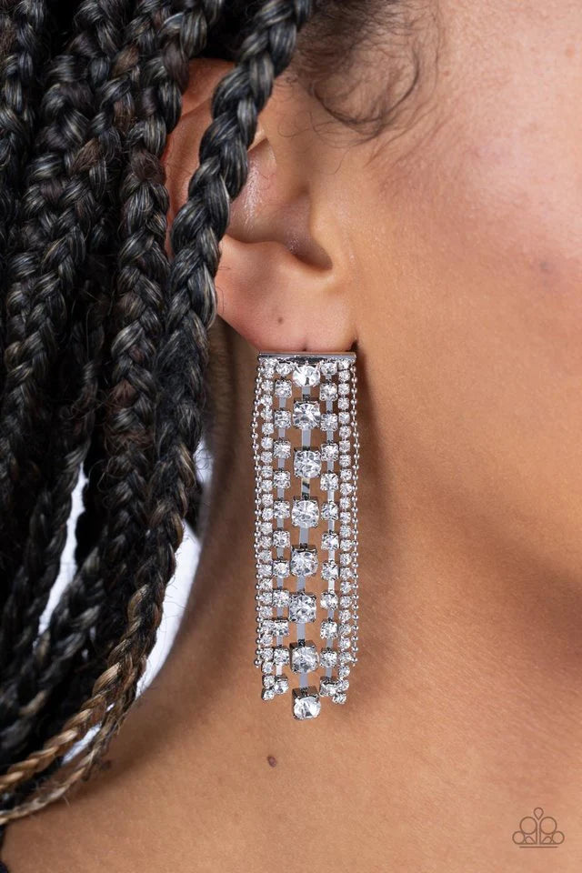 Paparazzi Accessories Starry Streamers - White Set in square silver fittings, strands of sparkly white rhinestones streams out from the bottom of a rectangular silver frame. Flanked by dainty silver ball chains, the sparkling fringe tapers into a tangible