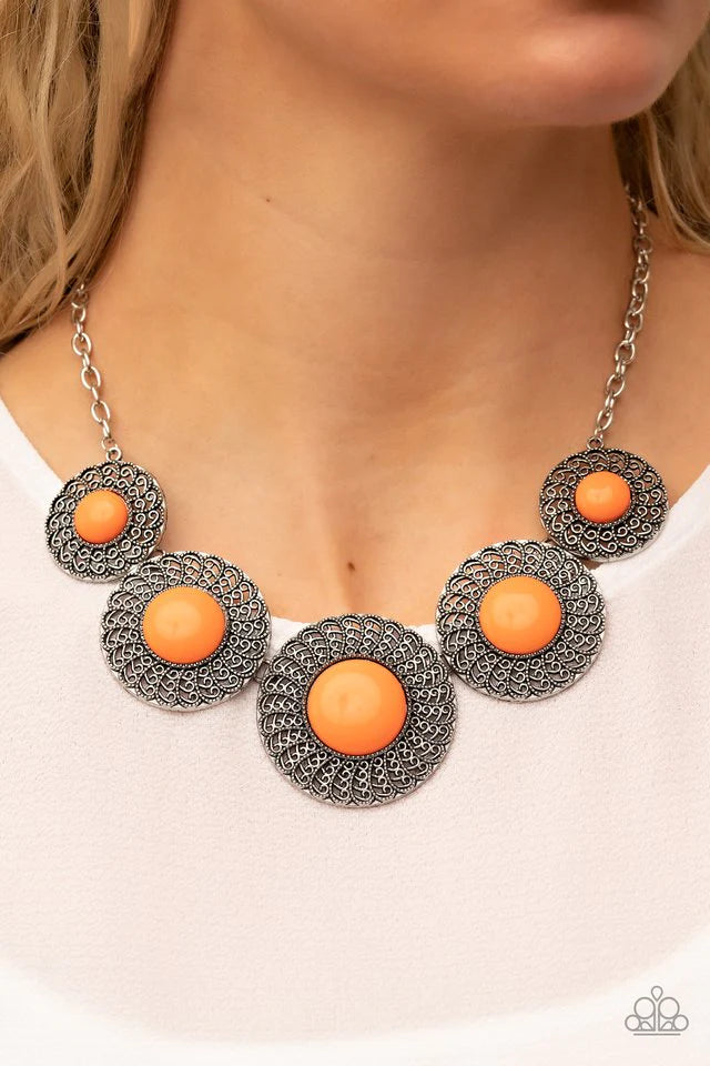 Paparazzi Accessories Detail Oriented - Orange Dotted with bubbly orange beads, silverdiscs spinning with swirly petal motifs gradually increase in size as they link below the collar for a statement-making floral fashion. Features an adjustable clasp clos