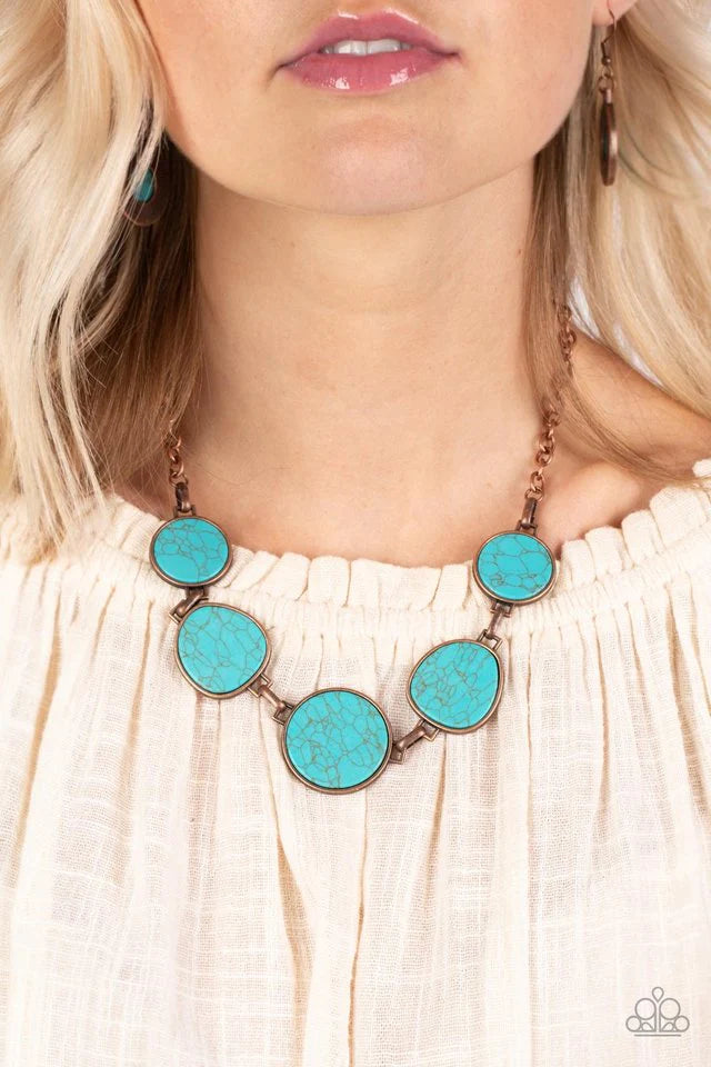 Paparazzi Accessories Santa Fe Flats - Copper Flat turquoise stones are pressed into antiqued copper frames, creating a bold, rustic statement piece. The irregular shape of the stones brings an artisanal touch to the design, as the hinge-like links connec