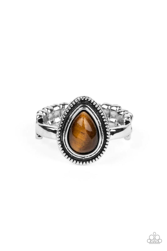 Paparazzi Accessories Eco Elements - Brown A tiger's eye teardrop stone is pressed into the center of a textured silver frame atop a dainty silver band, creating an earthy statement piece. Features a dainty stretchy band for a flexible fit. As the stone e