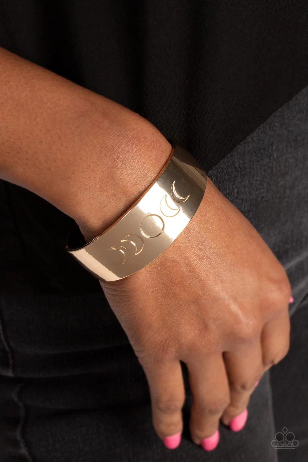 Paparazzi Accessories Lunar Effect - Gold The phases of the moon are engraved across the front of a thick, shiny, gold cuff, creating an effortlessly celestial statement piece. Sold as one individual bracelet. Jewelry