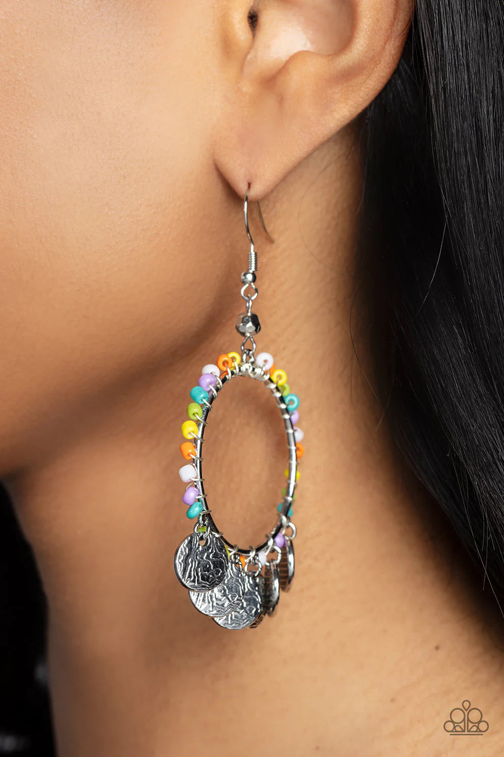 Paparazzi Accessories Bohemian Beach Blast - Multi Textured silver discs chime at the bottom of a silver wire hoop. Dainty multicolored seed beads are threaded along an invisible wire and wrapped around the hoop for a bohemian vibe. Earring attaches to a