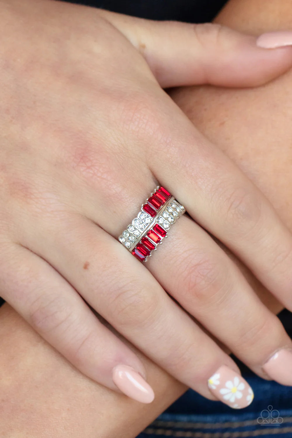 Paparazzi Accessories Put Them In Check - Red Stacks of dainty white and emerald cut red rhinestones connect across the finger, creating a glitzy checkered centerpiece atop the finger. Features a dainty stretchy band for a flexible fit. Sold as one indivi