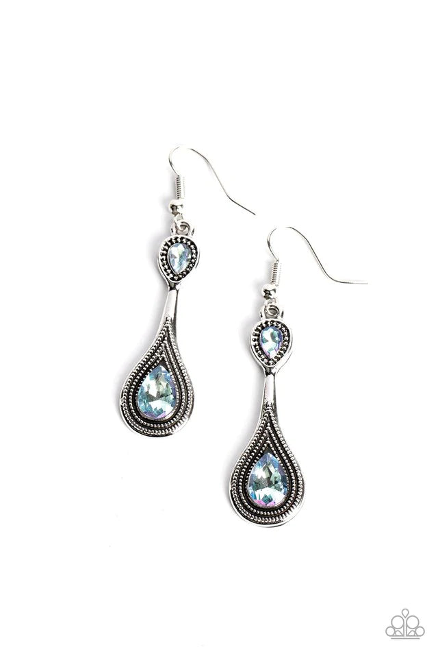 Paparazzi Accessories Dazzling Droplets - Blue Two iridescent blue rhinestones adorn the top and bottom of an extended silver lure radiating with studded textures, resulting in an ethereal dazzle. Earring attaches to a standard fishhook fitting. Due to it