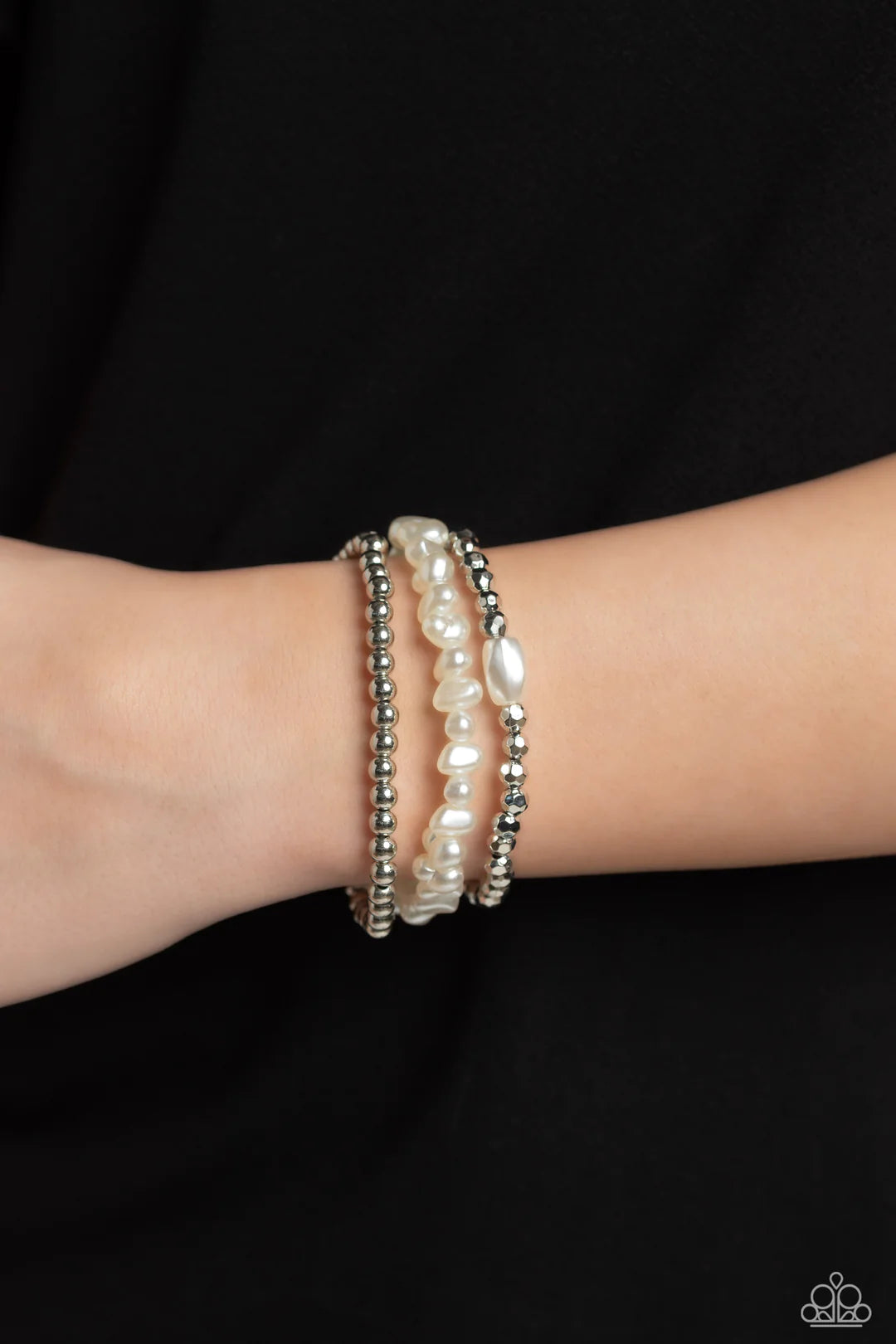 Paparazzi Accessories Effulgent Exchange - White Coalescing into a light-reflecting stack up the wrist, silver beads, baroque white pearl beads, and faceted silver beads with a solitaire white pearl bead wrap around the wrist on elastic stretchy bands for