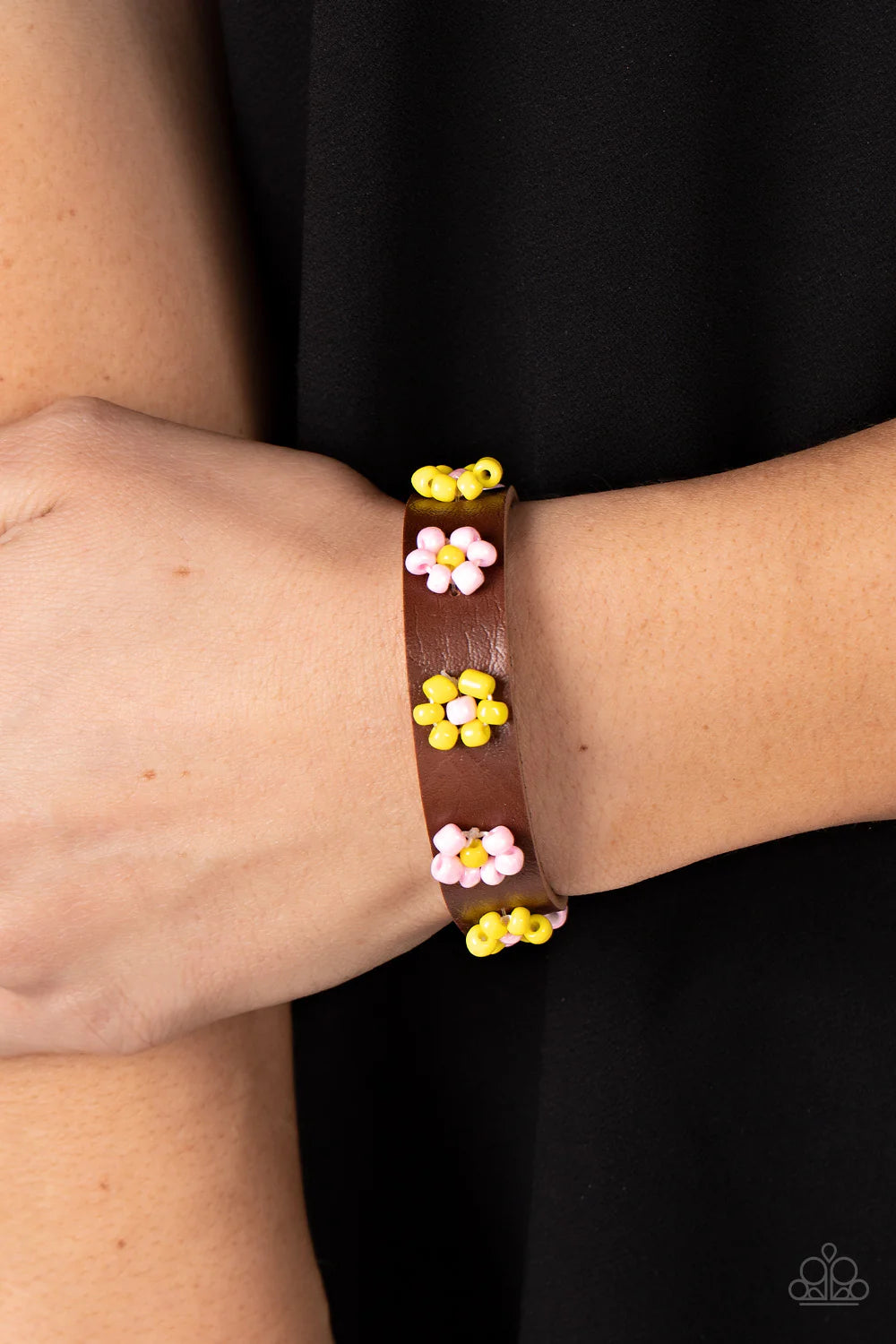 Paparazzi Accessories Flowery Frontier - Pink Pink and yellow beads bloom into vivacious flowers across the front of a brown leather band, bursting into a colorful floral accent. Features an adjustable sliding knot closure. Sold as one individual bracelet