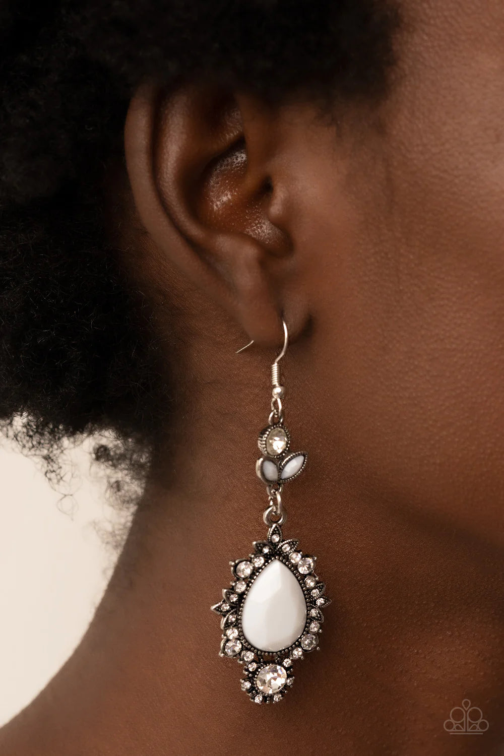 Paparazzi Accessories SELFIE-Esteem - White Dotted with dainty white rhinestones, leafy silver frames bloom from an oversized white teardrop bead that delicately hangs from a leafy white rhinestone and white beaded fitting for a whimsical finish. Earring