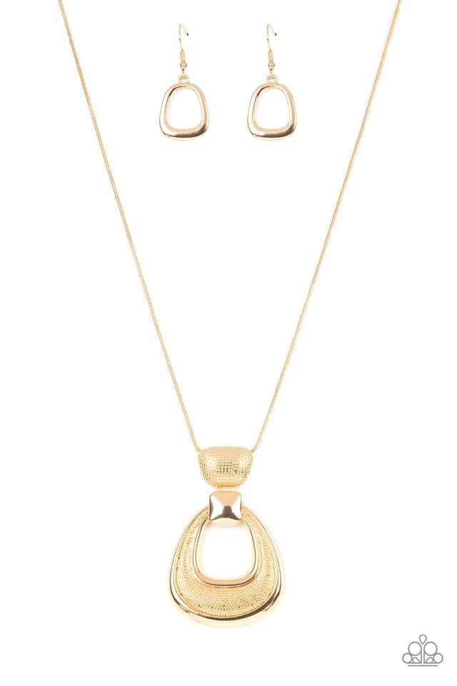 Paparazzi Accessories Park Avenue Attitude - Gold Topped with a smooth square-like accent, a hammered teardrop frame links to the bottom of a hammered gold fitting, creating a modern metallic pendant at the bottom of a rounded gold snake chain. Features a