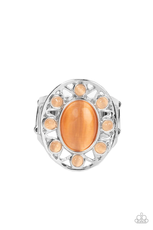 Paparazzi Accessories Sunny Solstice - Orange Dainty orange cat's eye stone beads radiate out from an oval orange cat's eye stone center, resulting in a radiant sunburst pattern atop the finger. Features a stretchy band for a flexible fit. Sold as one ind