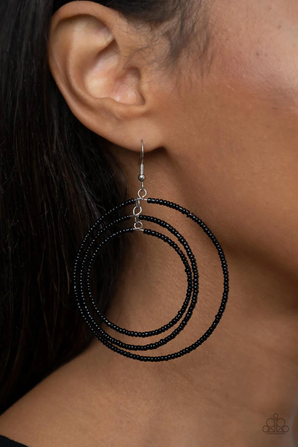 Paparazzi Accessories Colorfully Circulating - Black Three oversized rings of dainty black seed beads ripple into colorfully layered hoops, resulting in a dizzying display. Earring attaches to a standard fishhook fitting. Sold as one pair of earrings. Jew