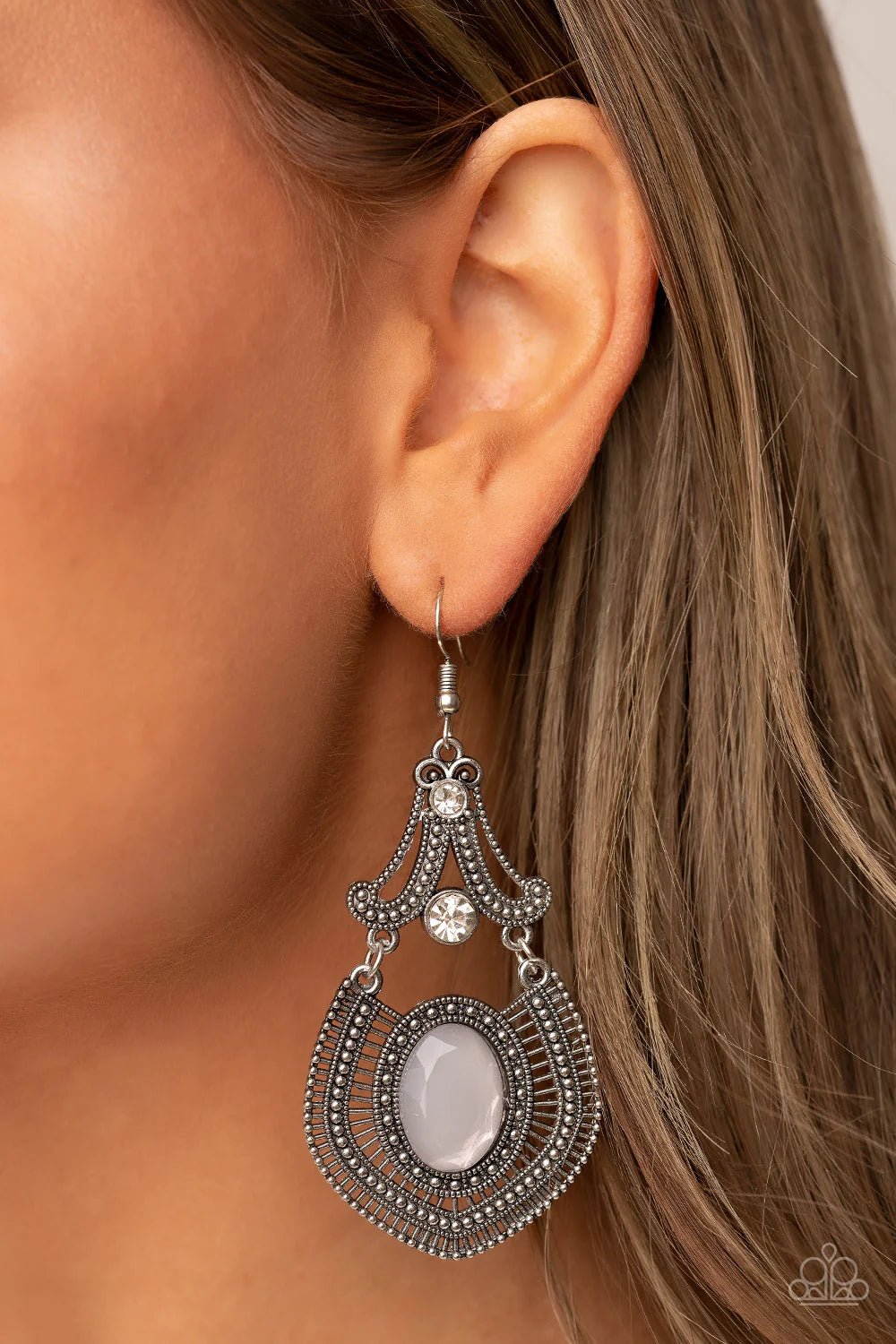 Paparazzi Accessories Panama Palace -Silver Studded silver detail and dainty silver bars fan out from an oversized opal gray gem at the bottom of a white rhinestone dotted frame, resulting in an ornate lure. Earring attaches to a standard fishhook fitting
