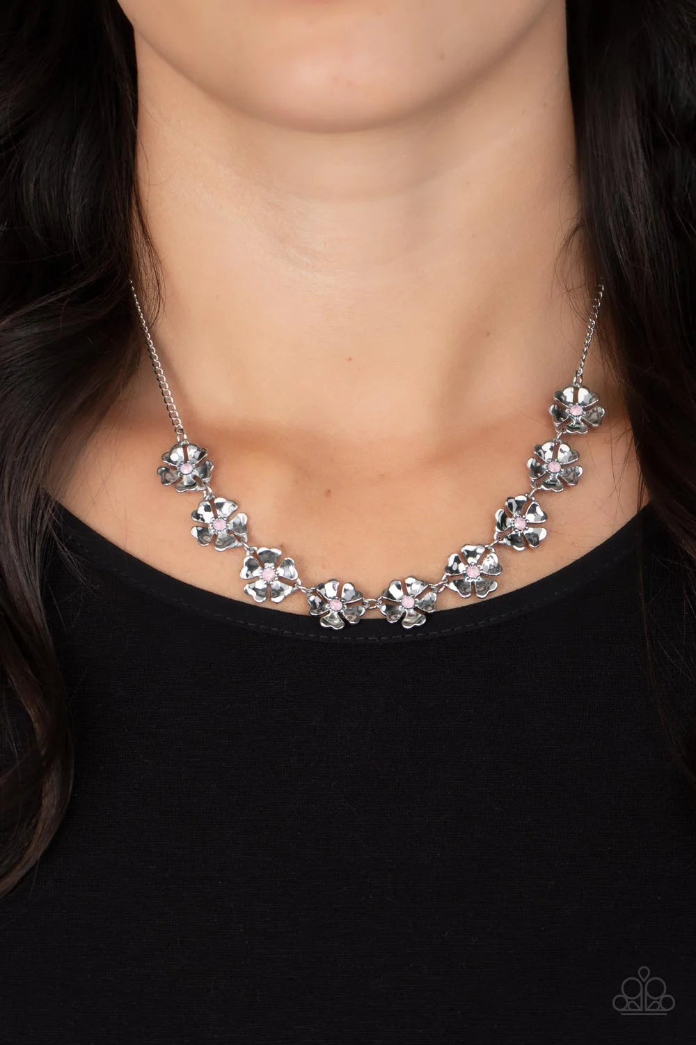 Paparazzi Accessories Petunia Palace - Pink Heart-shaped silver petals bloom from opaque Gossamer Pink rhinestone centers, creating colorful flowers. The dainty floral frames delicately dance below the collar, connecting into a whimsical centerpiece. Feat