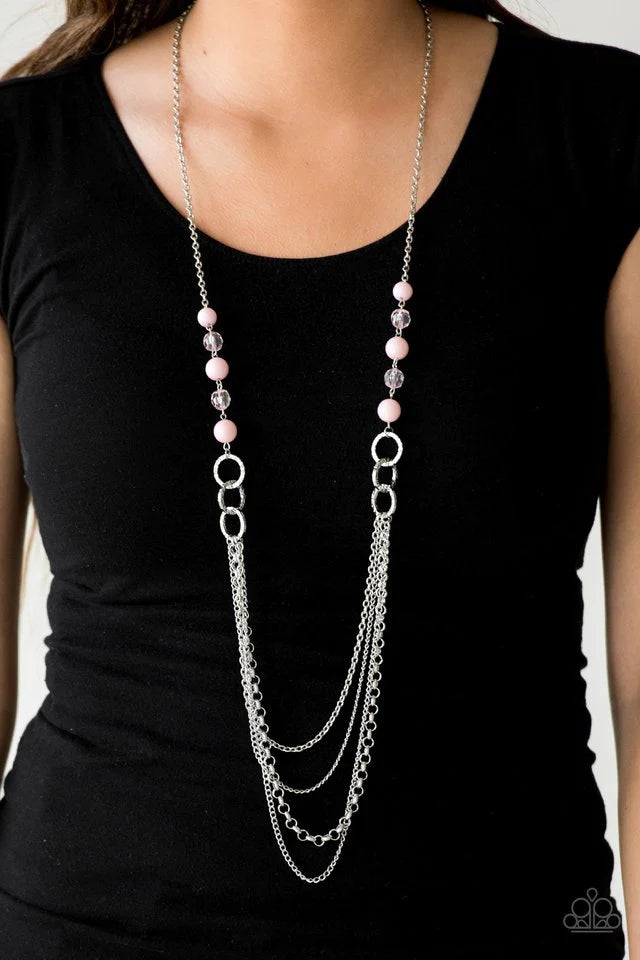 Paparazzi Accessories Vividly Vivid - Pink Polished pink, faceted crystal-like and delicately hammered silver hoops give way to mismatched silver chains down the chest for a whimsical look. Features an adjustable clasp closure.