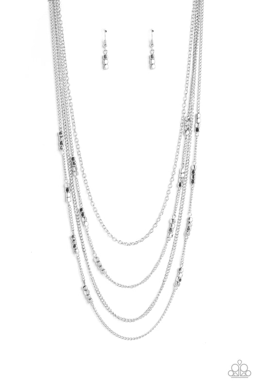 Paparazzi Accessories Metallic Monarch - Silver Glistening silver chains, sporadically infused with a quartet of silver beads link into fashionable layers below the neckline for a monochromatic medley. Features an adjustable clasp closure. Sold as one ind