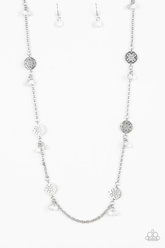 Paparazzi Accessories Color Boost - White Featuring glassy and polished finishes, dainty white beads join ornate silver frames along a shimmery silver chain for a whimsical look. Features an adjustable clasp closure. Sold as one individual necklace. Inclu