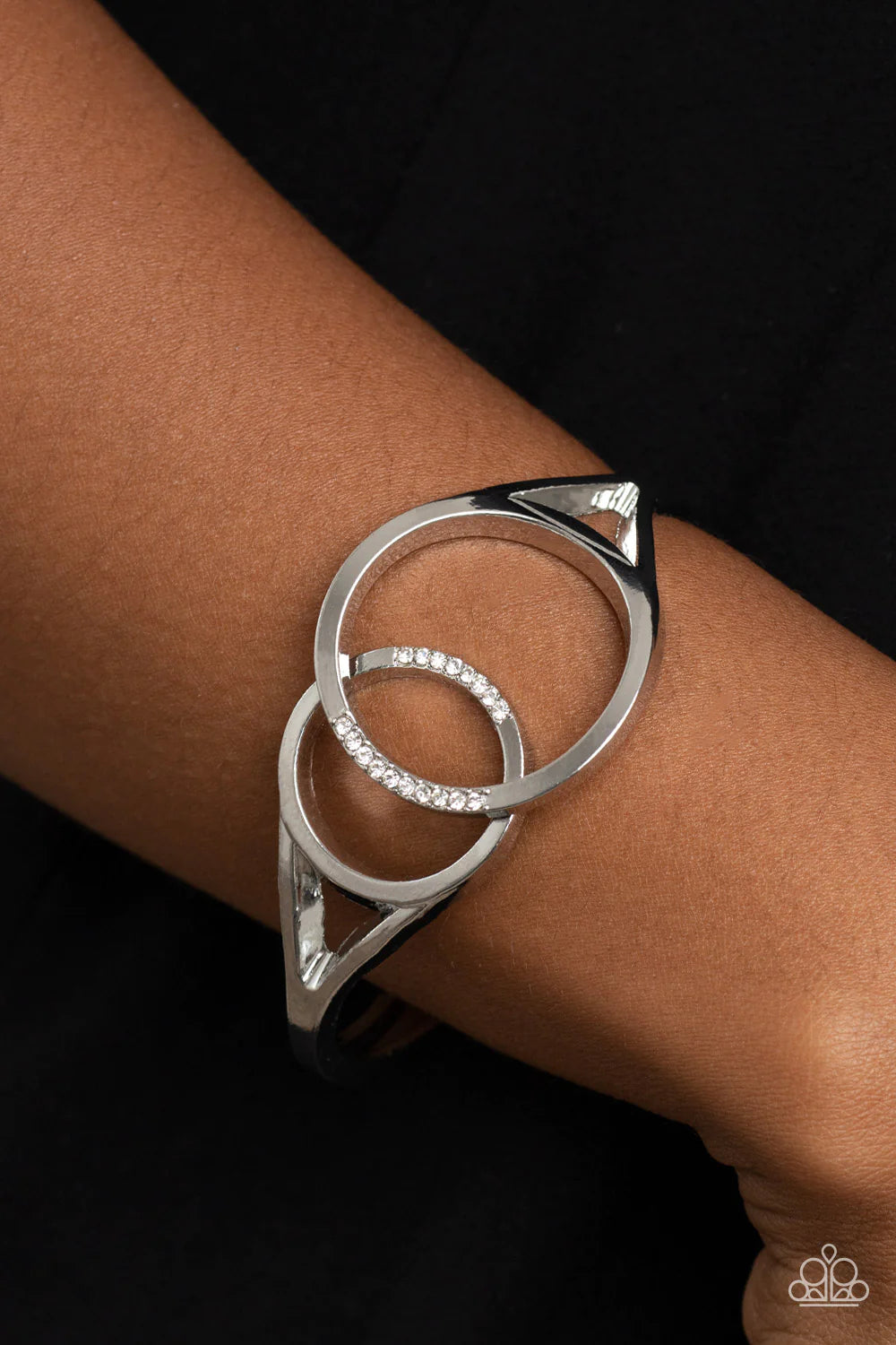 Paparazzi Accessories Scope of Experience - White Encrusted in sections of glassy white rhinestones, two oversized silver rings delicately overlap across the center of the wrist, resulting in a timeless bangle-like bracelet around the wrist. Features a hi