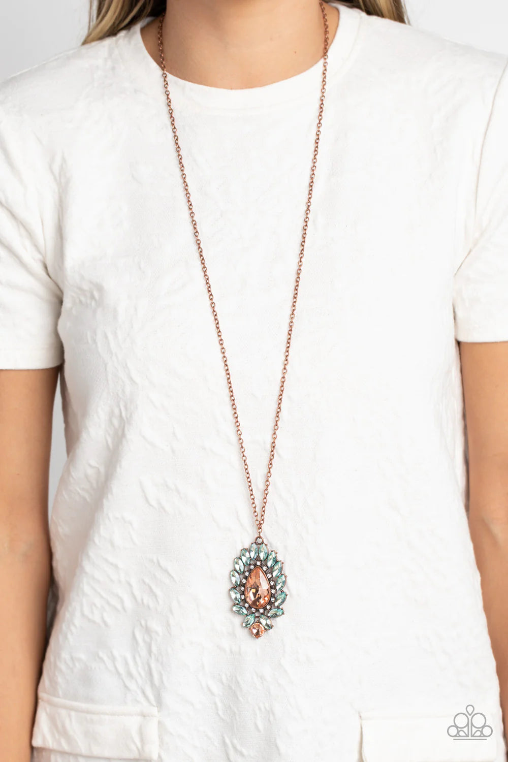 Paparazzi Accessories Over the TEARDROP - Copper Encircling an oversized, faceted, peachy teardrop, an explosion of light blue marquise-cut gems fans out below the chest reflecting light off every surface. A row of white rhinestones pressed in square copp