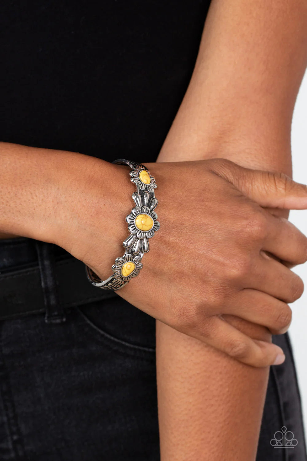 Paparazzi Accessories Winslow Walkabout - Yellow Dotted with yellow stone centers, a trio of summery wildflowers are embossed across the front of a textured silver cuff for a seasonal pop of color. Sold as one individual bracelet.