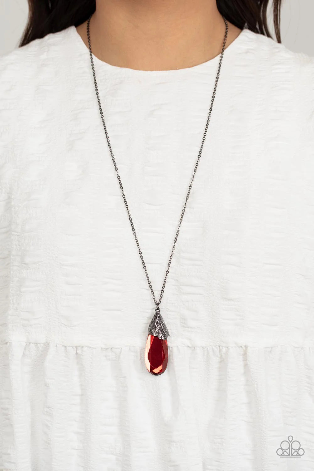 Paparazzi Accessories Dibs on the Dazzle - Red A dramatically elongated red teardrop gem with light-catching faceted edges is capped with a gunmetal fitting. A latticework pattern decorates the metallic fixture, with tiny flecks of hematite adding a hint