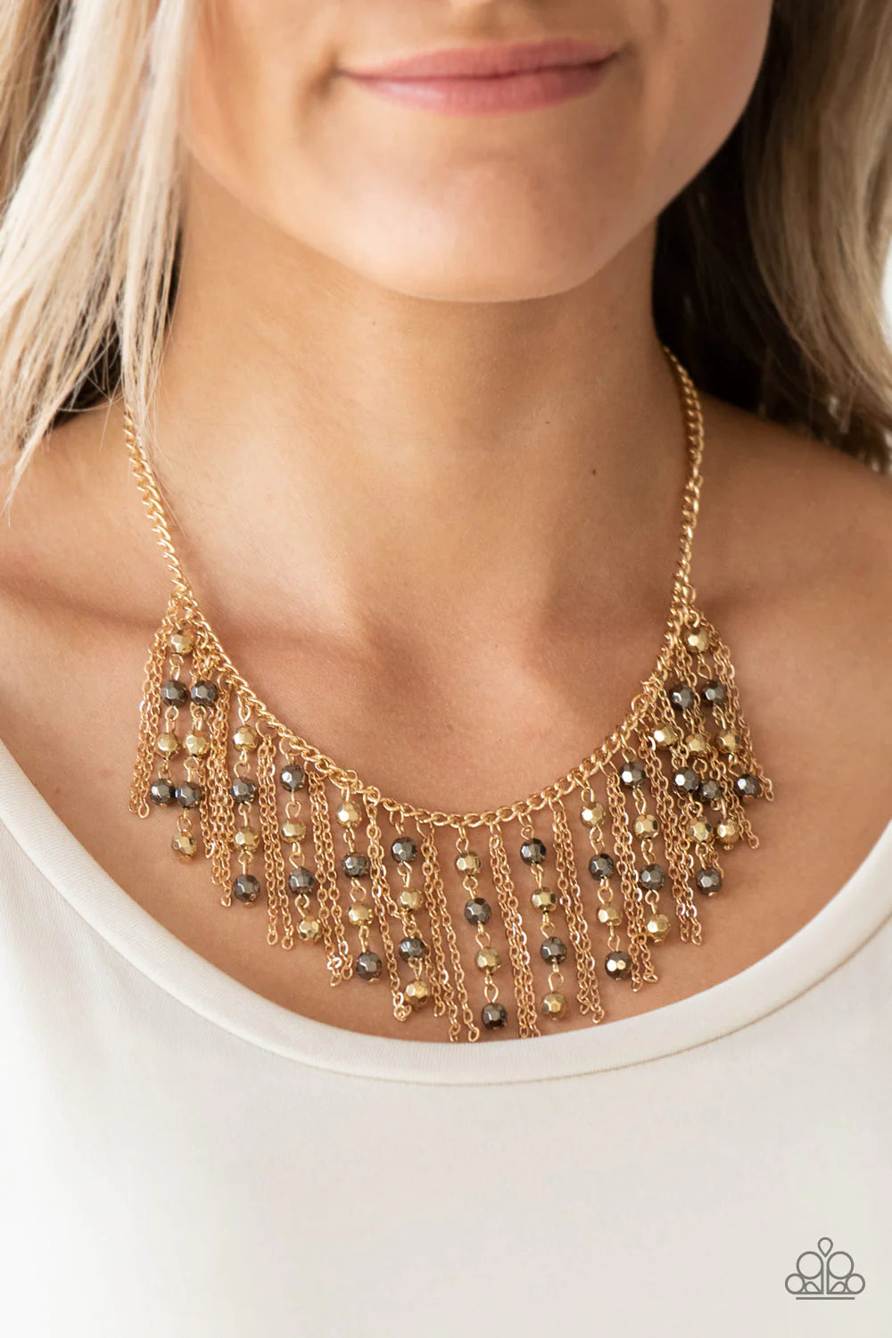 Paparazzi Accessories Rebel Remix - Multi Stands of faceted gold and gunmetal beads and glistening gold chains stream from a matching gold chain, creating an edgy fringe below the collar. Features an adjustable clasp closure. Sold as one individual neckla