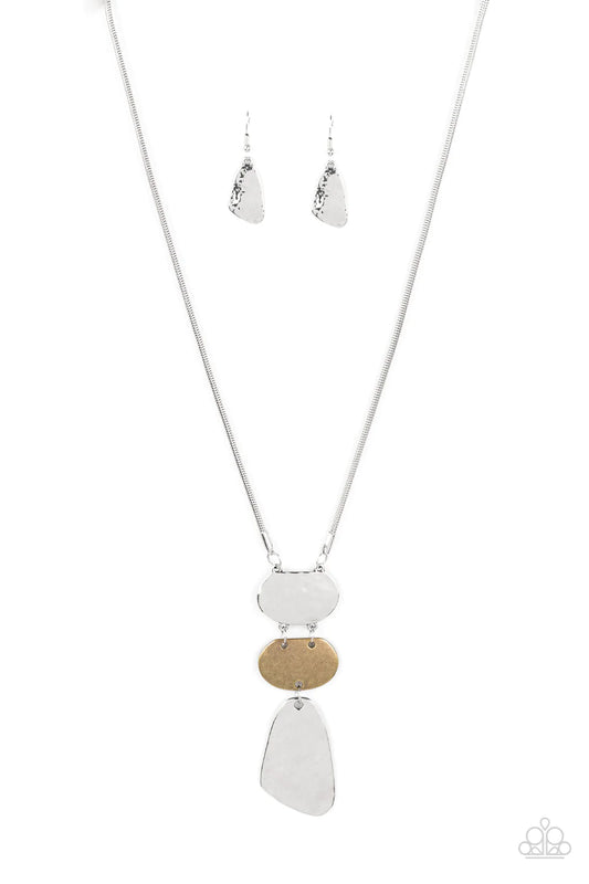 Paparazzi Accessories Riverside Respite - Silver Featuring asymmetrical shapes, hammered silver plates flank a burnished brass frame at the bottom of an extended silver snake chain for an edgy yet rustic look. Features an adjustable clasp closure. Sold as