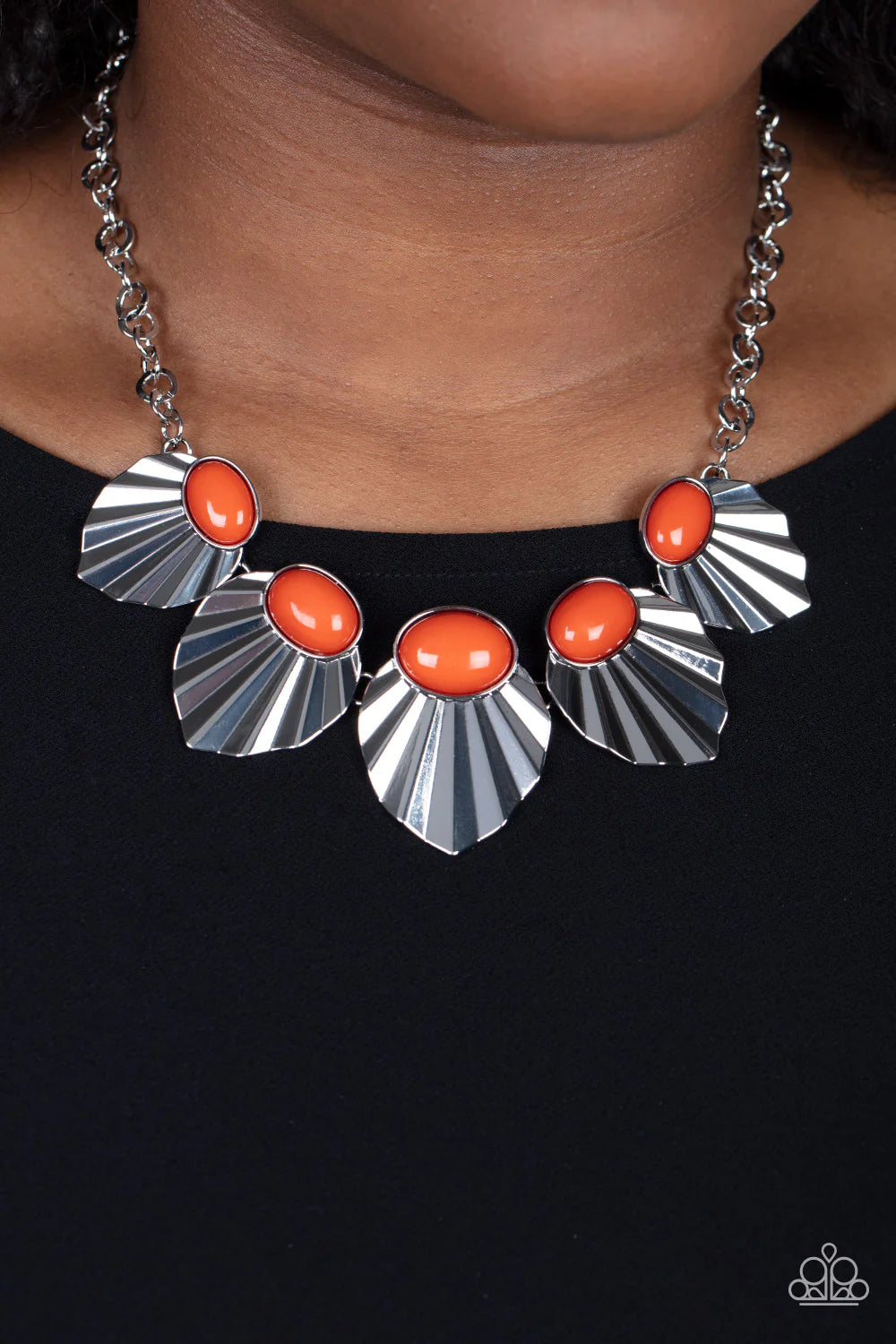 Paparazzi Accessories Fearlessly Ferocious - Orange Crowned in oval Burnt Orange beads, a collection of crimped and scalloped silver frames gradually increase in size as they fearlessly fan out below the collar for a ferocious fashion. Features an adjusta