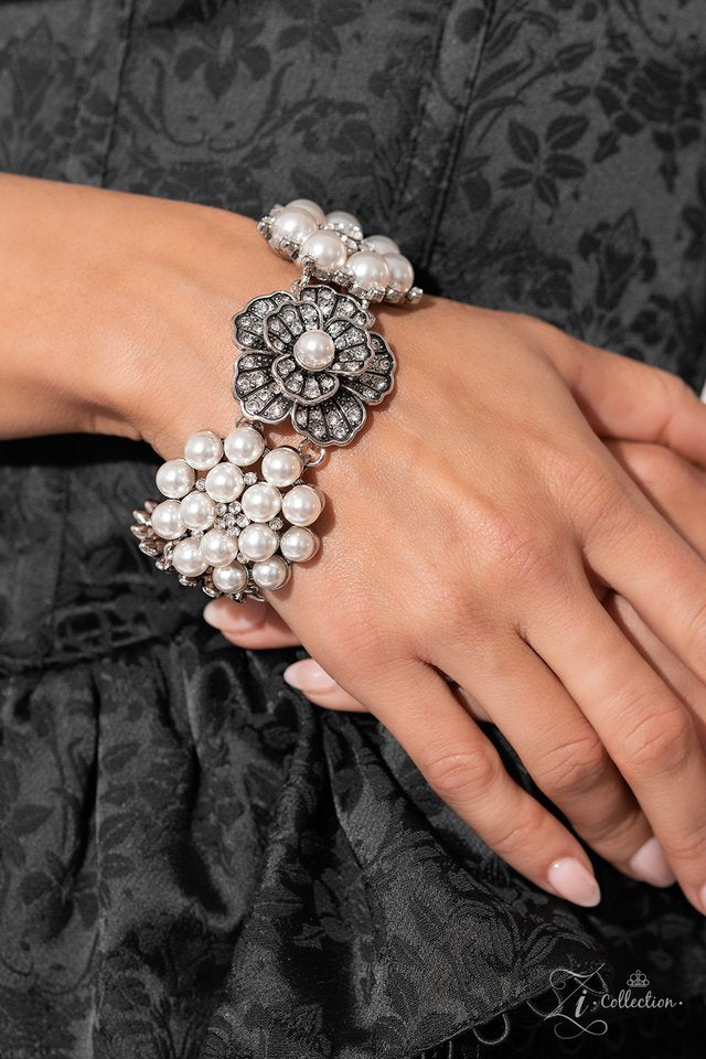 Paparazzi Accessories Self-Made - White Polished white pearls and brilliant white rhinestones bloom into five unique flowers adorned in dizzying detail. Each flower features a unique centerpiece that is encircled by shimmery luminescence and intricate det