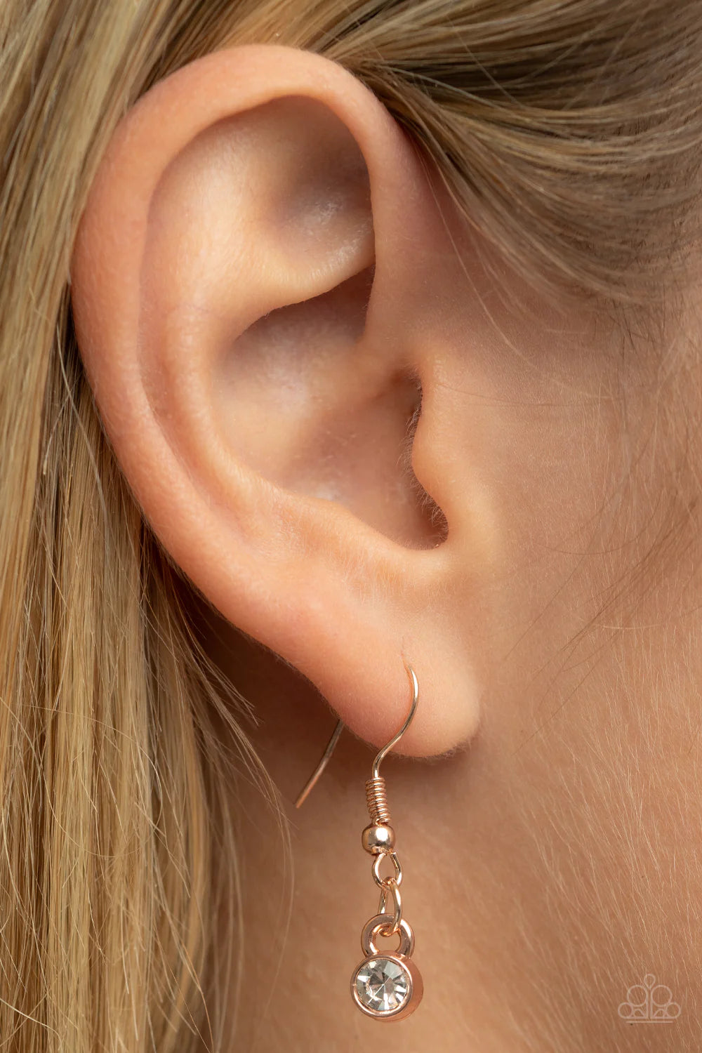 Paparazzi Accessories Boom and COMBUST - Rose Gold Dainty white rhinestones are haphazardly sprinkled across the front of an oversized and hammered rose gold disc, resulting in an explosion of shimmer at the bottom of an extended rose gold chain. Features