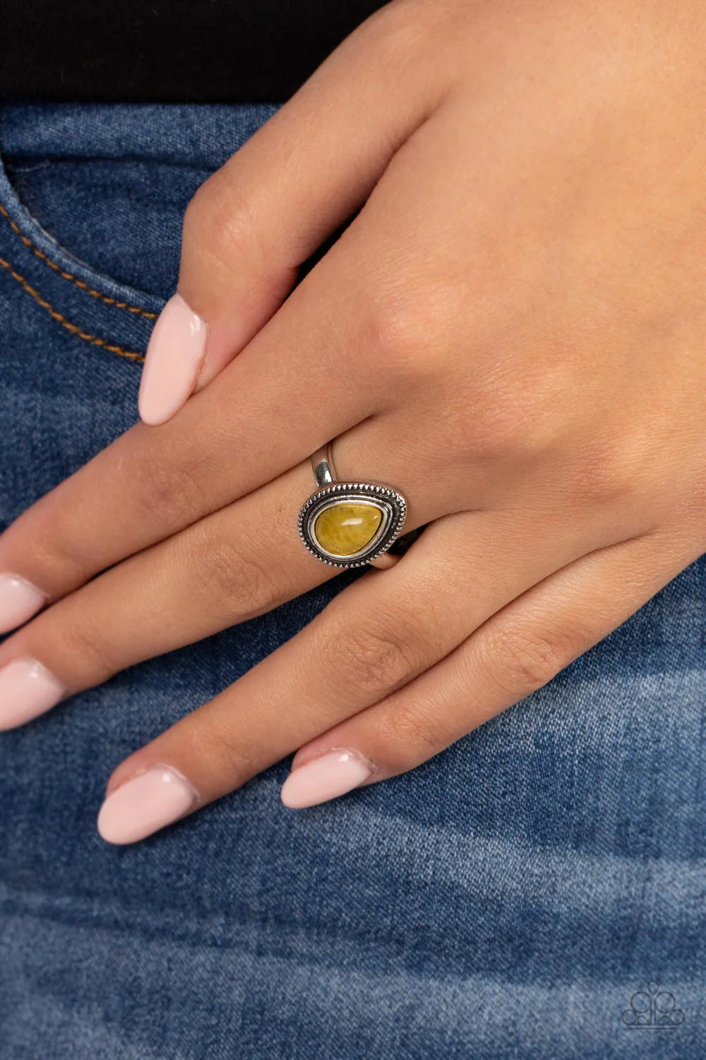 Paparazzi Accessories Eco Elements - Yellow A yellow teardrop stone is pressed into the center of a textured silver frame atop a dainty silver band, creating an earthy statement piece. Features a dainty stretchy band for a flexible fit. As the stone eleme