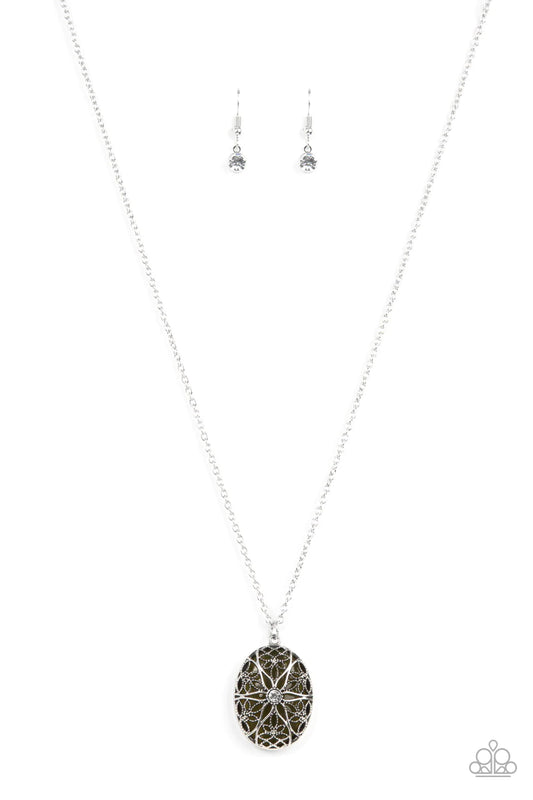 Paparazzi Accessories Venice Vacation - Green Dotted with a glitzy white rhinestone center, studded and smooth floral filigree detail blooms across the front of an oversized and Olive Branch cat's eye stone, resulting in a whimsical pendant at the bottom