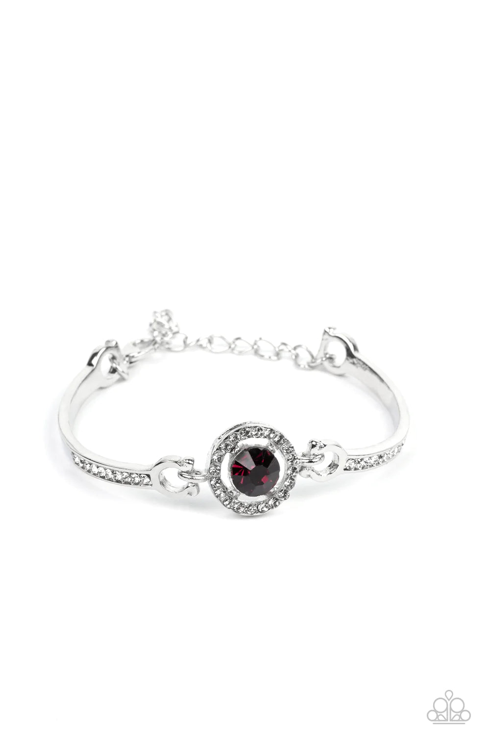 Paparazzi Accessories Focused and Fabulous - Purple A brilliant purple rhinestone sparkles inside a circular frame of dainty white rhinestones. Curved silver bars adorned with a row of rhinestones connect on each side of the frame, wrapping around the wri