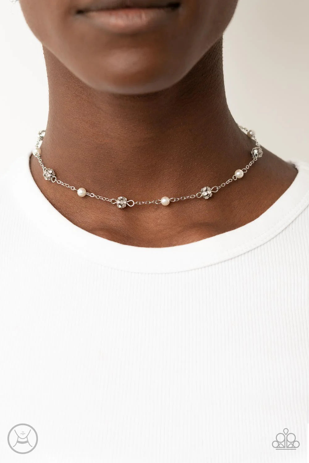 Paparazzi Accessories Rumored Romance - White A dainty silver chain dotted in bubbly white pearls and glitzy white rhinestone encrusted beads delicately connects around the neck, resulting in a timeless fashion. Features an adjustable clasp closure. Sold