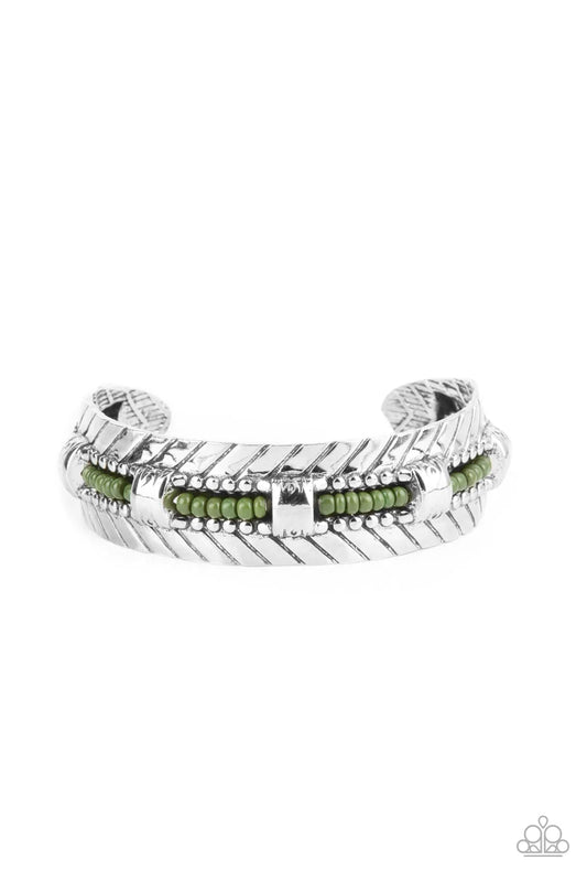 Paparazzi Accessories Sonoran Scene - Green A row of Olive Branch seed beads is threaded along a wire inside a studded silver frame as it flows around a silver cuff. Flared antiqued silver accents embellish the edges of the cuff for a rustic finish. Sold