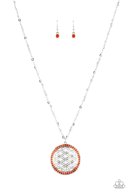 Paparazzi Accessories Tearoom Twinkle - Orange Bright dainty Sun Orange rhinestones create a brilliant round frame brimming with airy floral petals, coalescing into a charming medallion that sways from the bottom of a lengthened silver chain. Features an