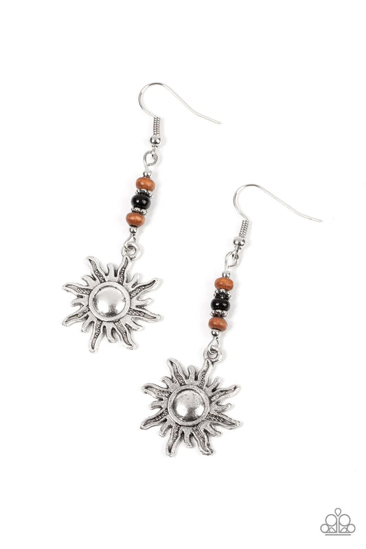 Paparazzi Accessories Sunshiny Days - Black Dainty silver rings, wooden beads, and a shiny black accent are threaded along a silver rod that attaches to a rustic silver sun charm, resulting in a groovy lure. Earring attaches to a standard fishhook fitting