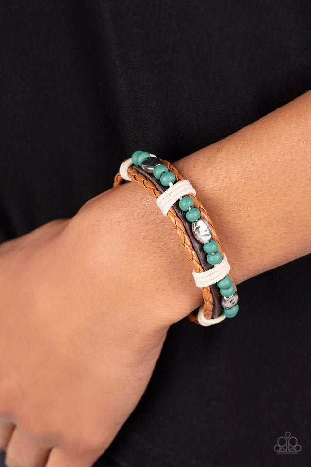 Paparazzi Accessories Lodge Luxe - Blue Blue wooden beads and textured silver accents are threaded along a natural cord atop a dark brown leather band. Light brown braided leather bands create a border as the collection is wrapped in sections with natural