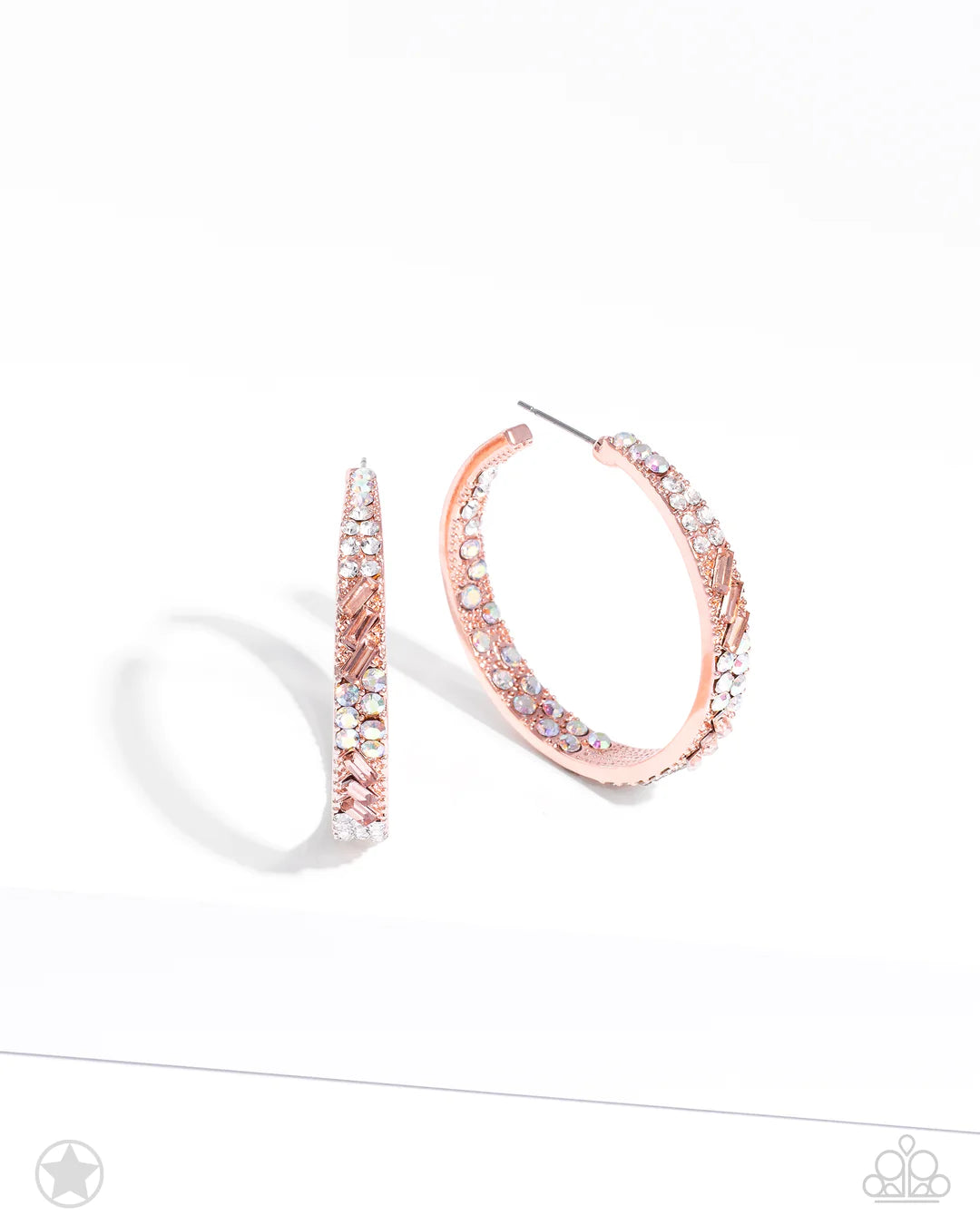 Paparazzi Accessories Glitzy by Association - Copper The front facing surface of a chunky shiny copper hoop is dipped in brilliantly sparkling iridescent, peach, and white rhinestones while light-catching texture wraps around the back. The interior of the
