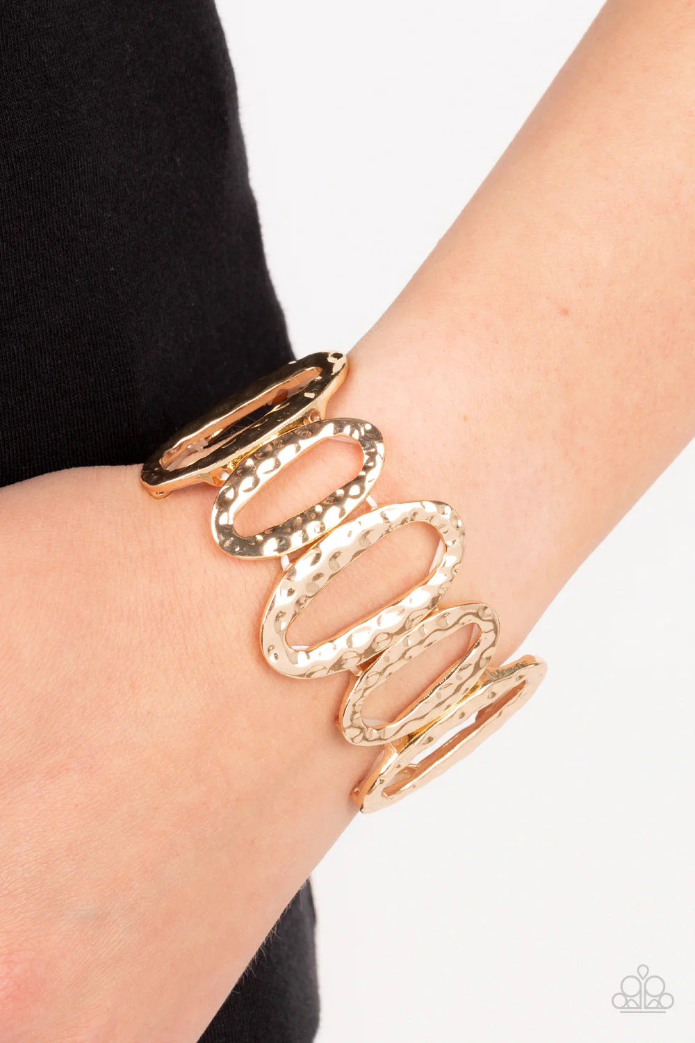 Paparazzi Accessories Homestead Heirloom - Gold Hammered in a tactile shimmer, an asymmetrical collection of large and medium sized gold oval frames alternates along stretchy bands around the wrist for a handcrafted vibe. Sold as one individual bracelet.