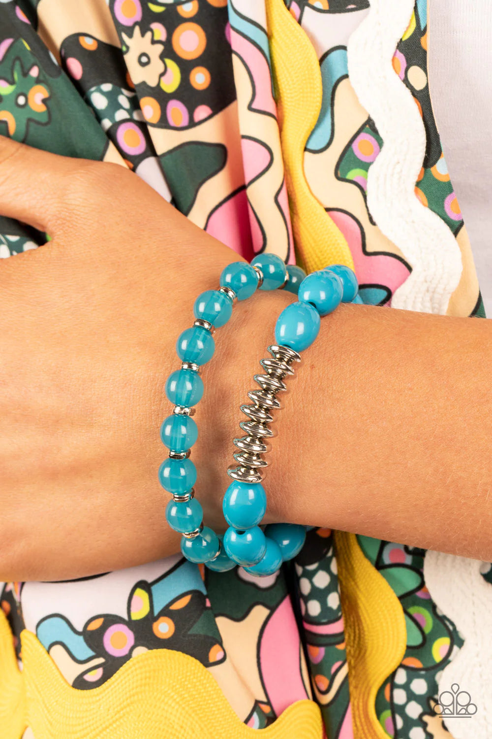 Paparazzi Accessories La Vida Vacation - Blue Infused with silver accents, rows of glassy and acrylic blue beads are threaded along stretchy bands around the wrist, resulting in a refreshing pop of color. Sold as a pair of bracelets. Jewelry