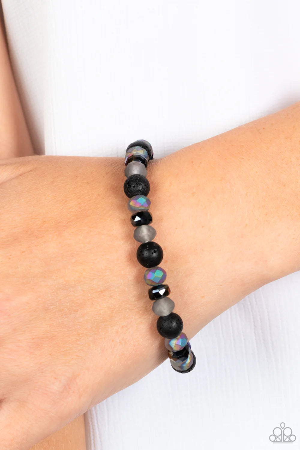 Paparazzi Accessories Endless LAVA - Multi An earthy collection of black lava rock beads, oil spill disc beads, and faceted stones brushed in an oil spill shimmer are threaded along a stretchy band around the wrist, resulting in an edgy stellar look. Due