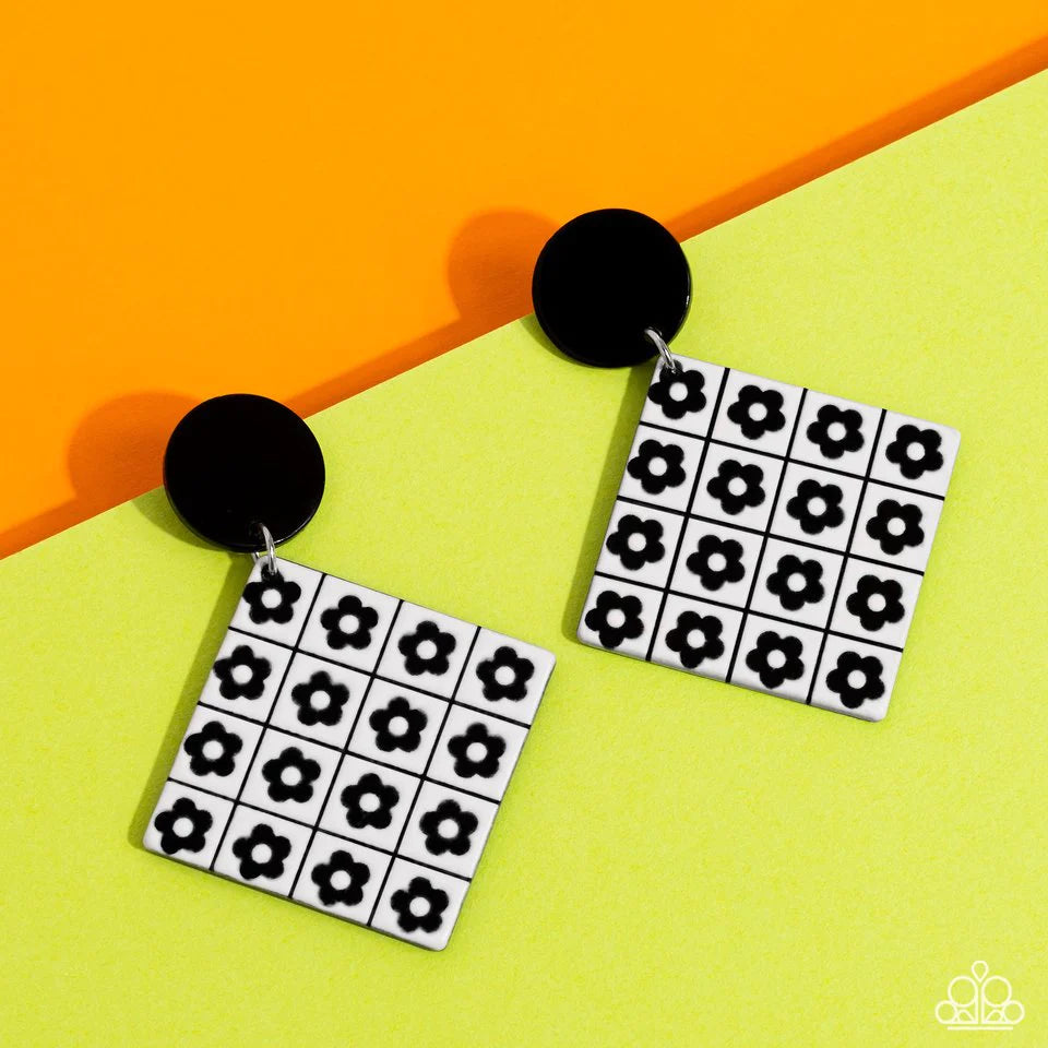 Paparazzi Accessories Vintage Vaudeville - Black Featuring a monochrome floral arrangement, black flowers are symmetrically arranged on a white square-cut acrylic frame for a high-fashion statement at the ear. The floral feature swings from a solid black